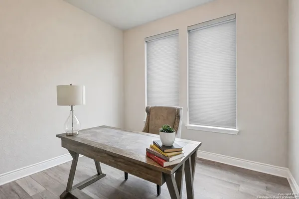 a workspace with furniture and window