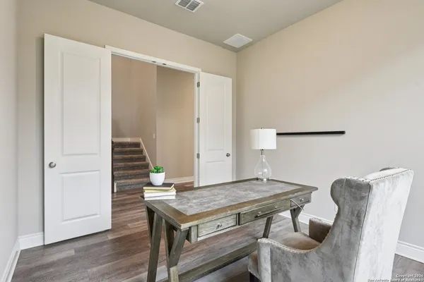 a view of a dining room with furniture and window