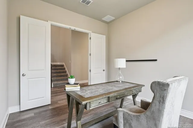 a view of a dining room with furniture and window