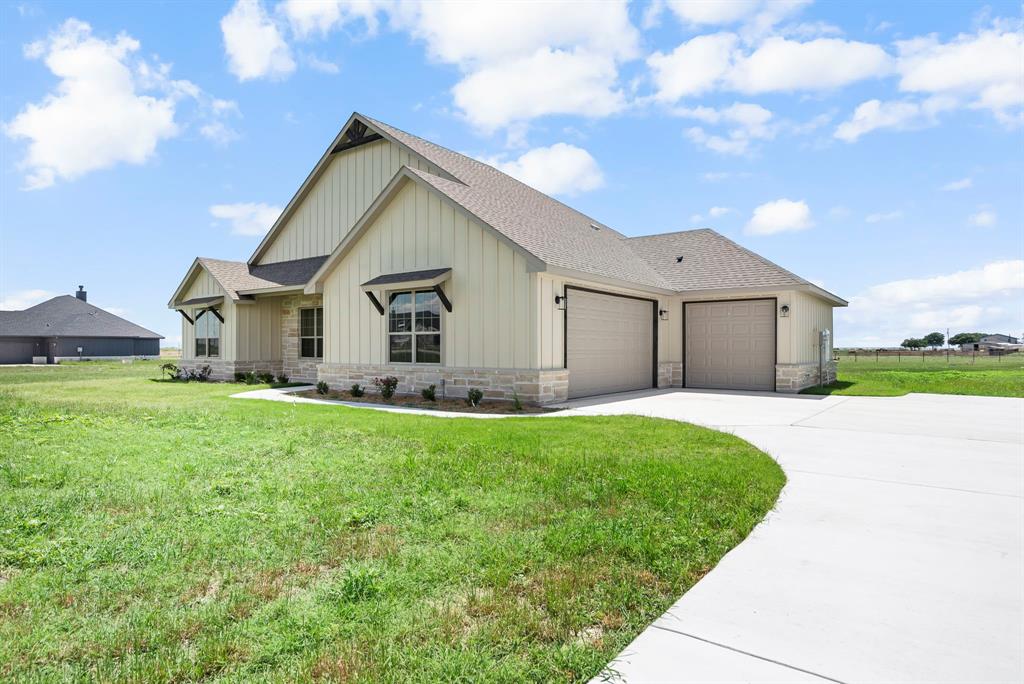 a view of a back yard of the house