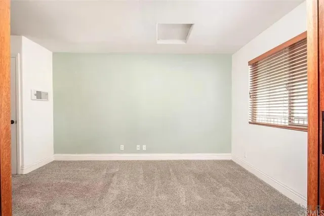 a view of a bathroom with a shower and a sink
