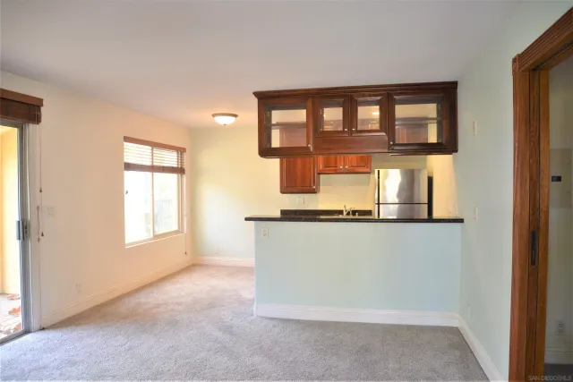 a kitchen with stainless steel appliances granite countertop a stove and a microwave