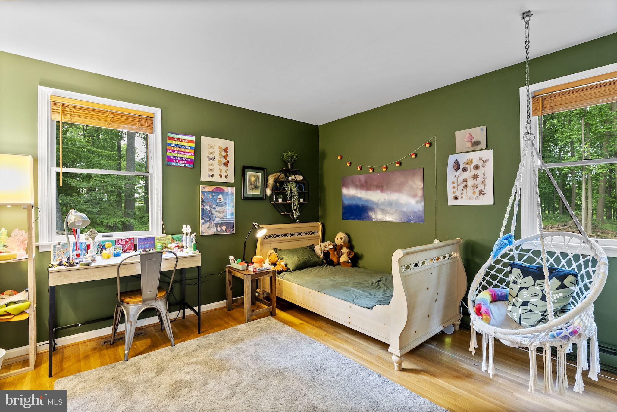 12851 Stone Eagle Road Phoenix, MD 21131 - Photo 42 of 67 a living room with furniture a window and a flat screen tv