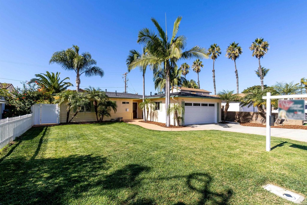 3915 Linmar Lane Carlsbad, CA 92008 - Photo 2 of 25 a house with palm tree in front of it