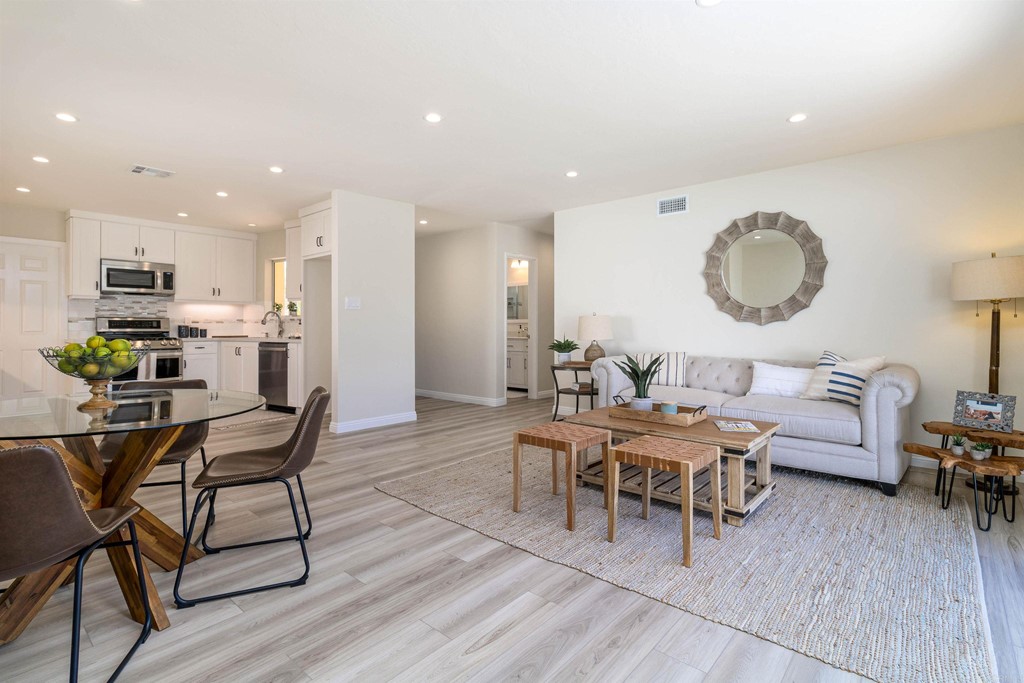 3915 Linmar Lane Carlsbad, CA 92008 - Photo 14 of 25 a living room with furniture and a wooden floor