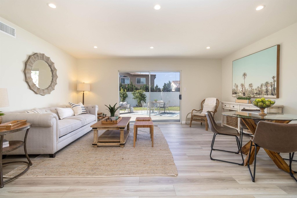 3915 Linmar Lane Carlsbad, CA 92008 - Photo 16 of 25 a living room with furniture a rug a lamp and a table
