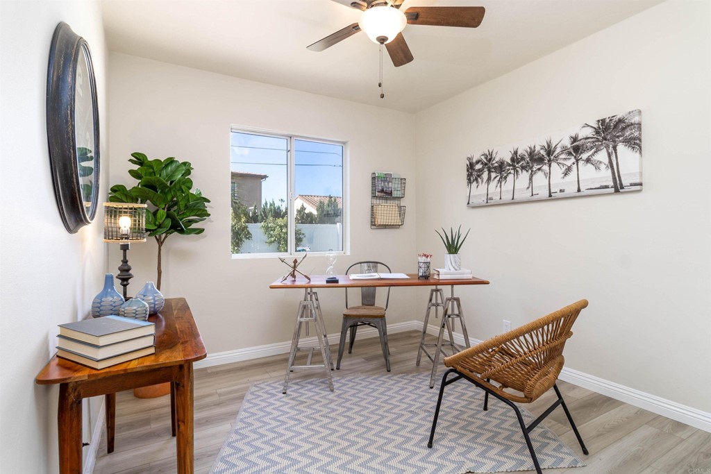 3915 Linmar Lane Carlsbad, CA 92008 - Photo 8 of 25 a view of a livingroom with furniture and a potted plant