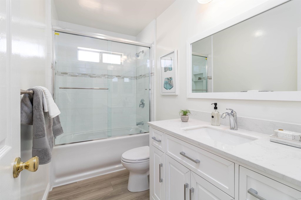 3915 Linmar Lane Carlsbad, CA 92008 - Photo 9 of 25 a bathroom with a sink a toilet and shower