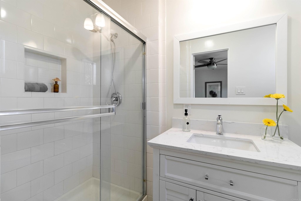 3915 Linmar Lane Carlsbad, CA 92008 - Photo 10 of 25 a bathroom with a sink and a mirror