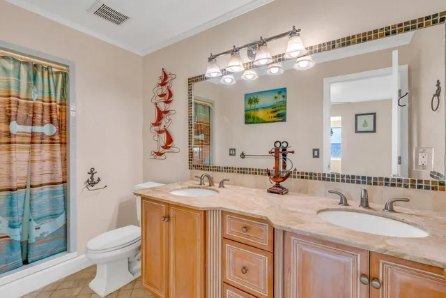 a bedroom with a large bed and a large window