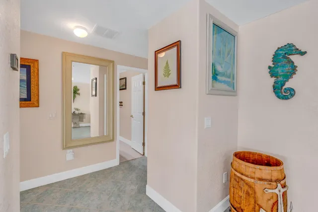 a bathroom with a sink a mirror and vanity