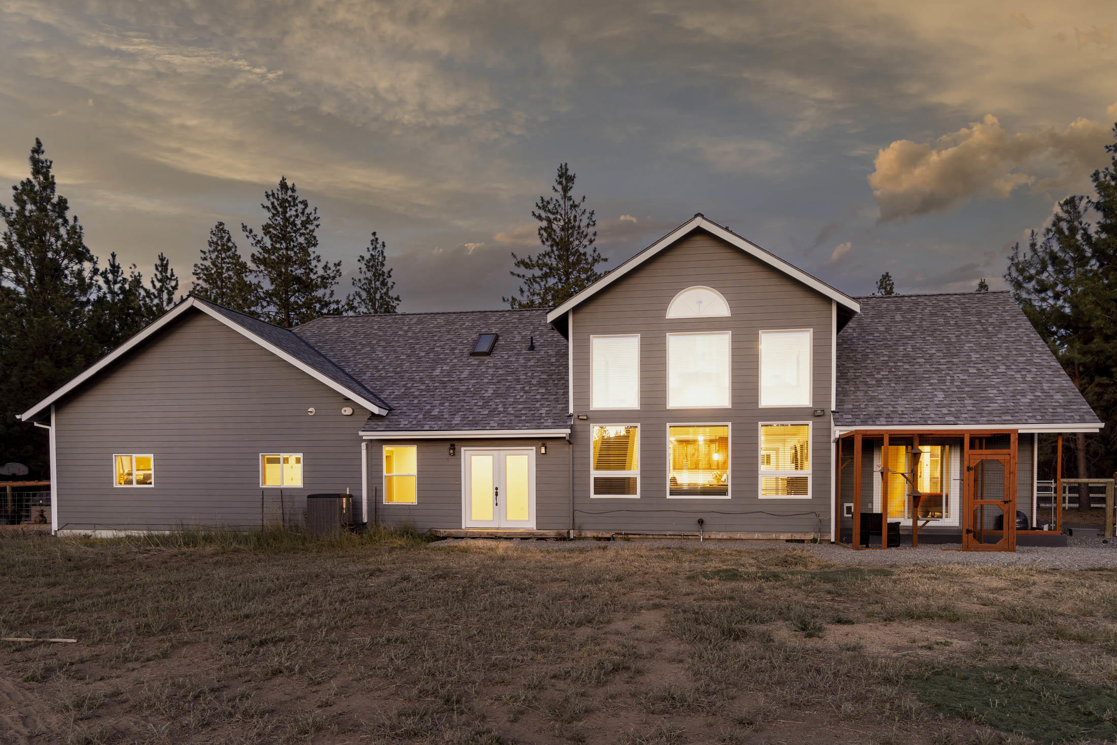 19166 Buck Canyon Road Bend, OR 97702 - Photo 55 of 63 Back of home at dusk