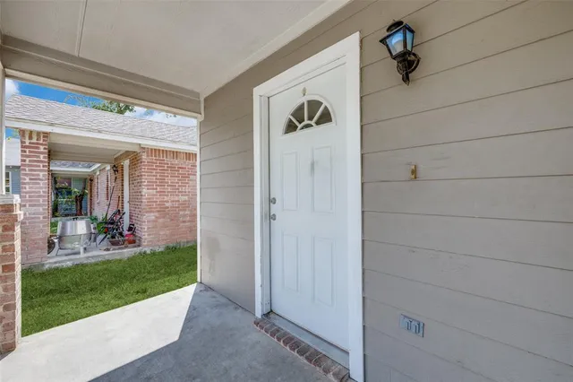 a view of house with backyard area