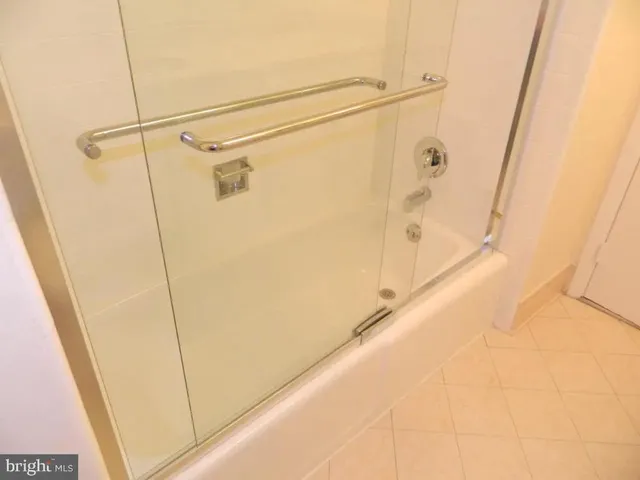a bathroom with a shower and a sink