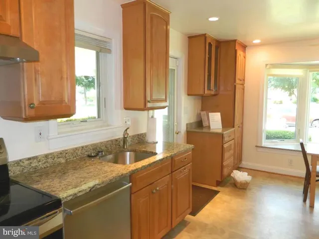 a kitchen with a stove and a microwave