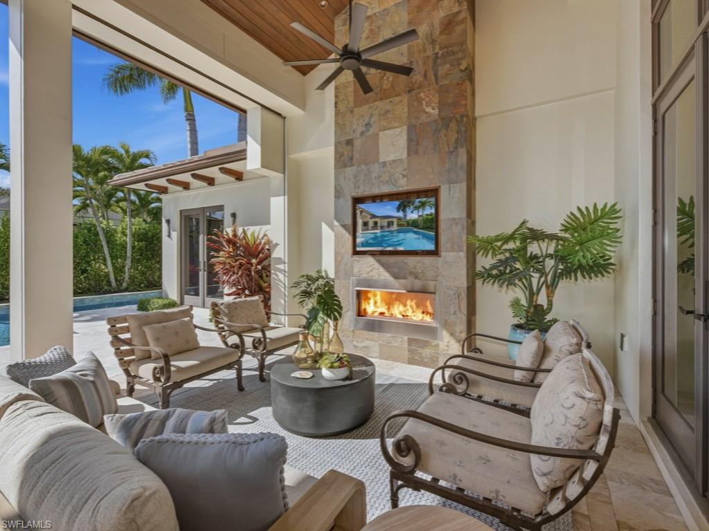 600 Anchor Rode Drive Naples, FL 34103 - Photo 19 of 29 Outdoor Seating Area with Fireplace
