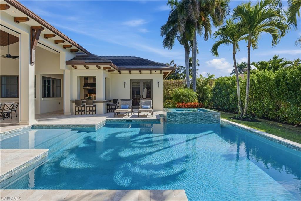 600 Anchor Rode Drive Naples, FL 34103 - Photo 24 of 29 Scenic South-Facing Pool Framed by Palms