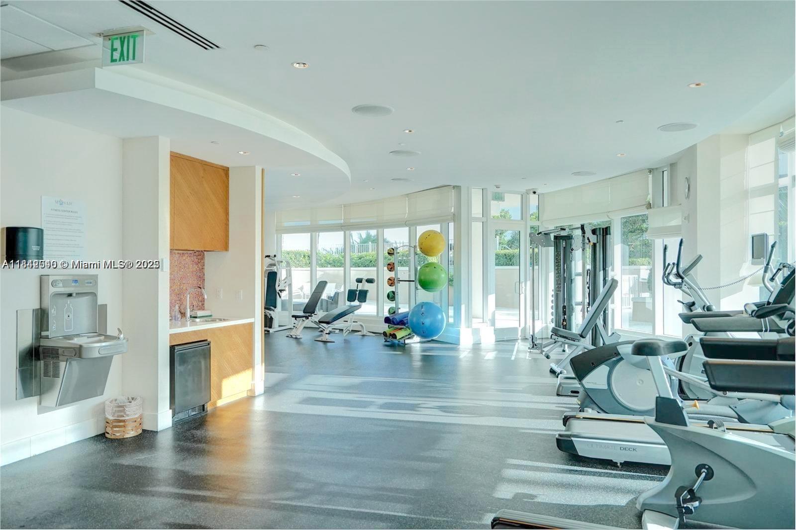 3801 Collins Avenue, Unit 1104 Miami Beach, FL 33140 - Photo 31 of 43 a living room with fireplace furniture and a wooden floor