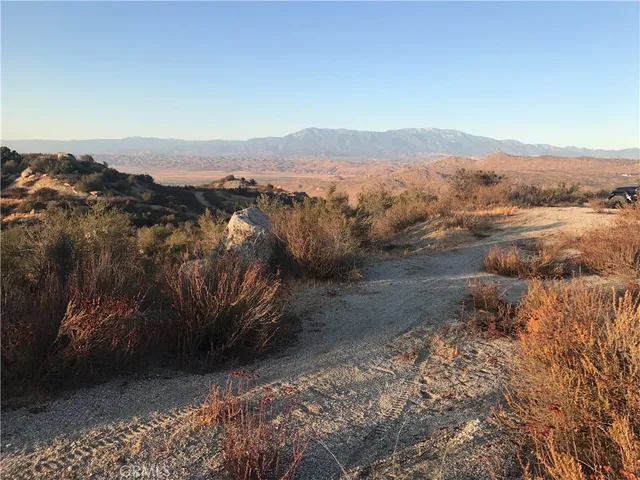 a view of a town with mountains in the background