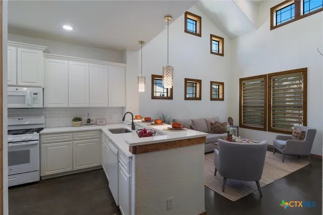 a view of a kitchen with a sink cabinets and window