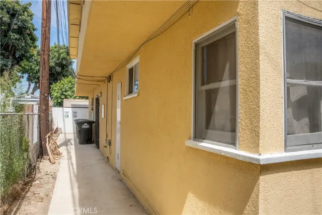 a view of a house with a door and wooden floor