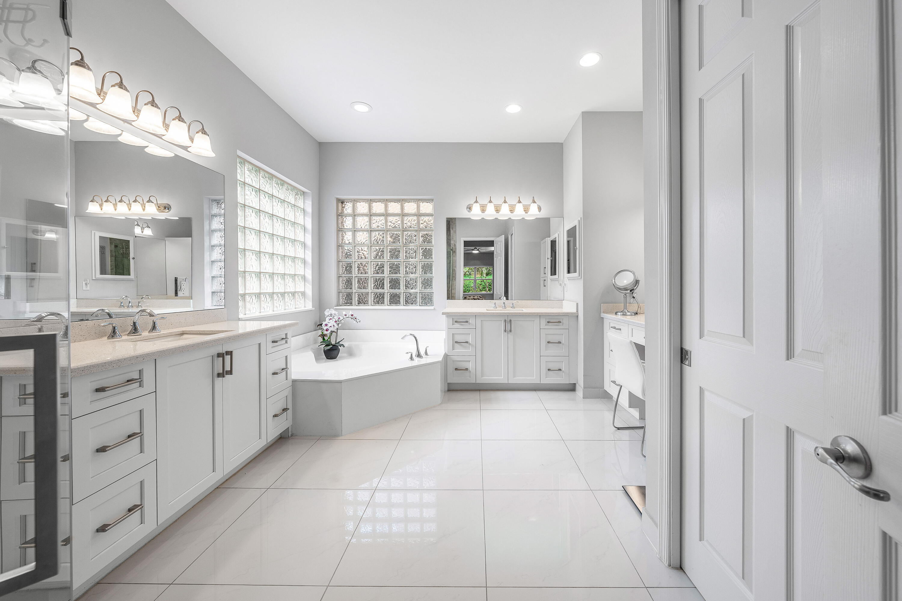 11639 Dawson Range Road Boynton Beach, FL 33473 - Photo 21 of 75 a large bathroom with a glass door shower a sink and a mirror