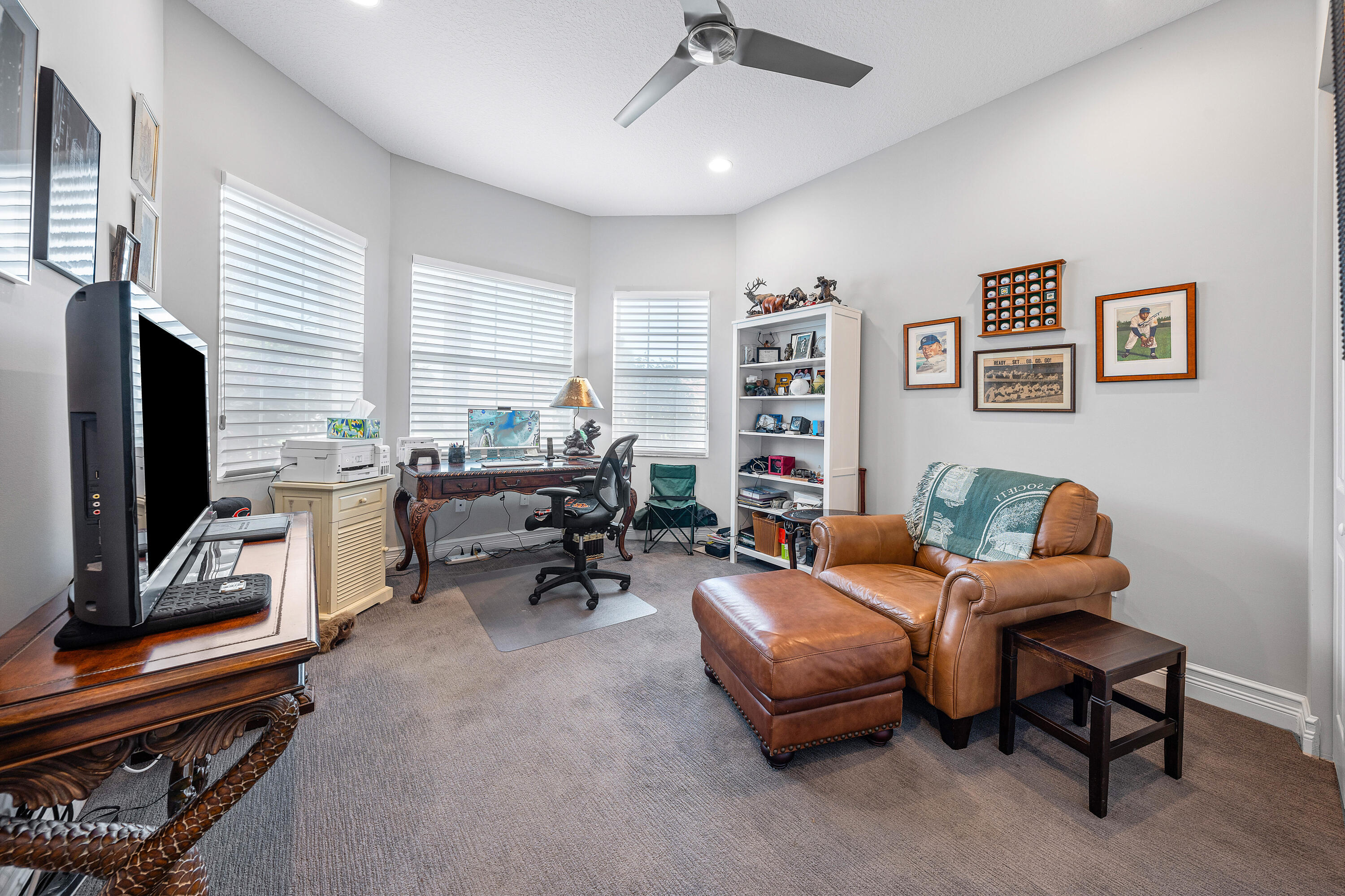 11639 Dawson Range Road Boynton Beach, FL 33473 - Photo 24 of 75 a living room with furniture and a flat screen tv