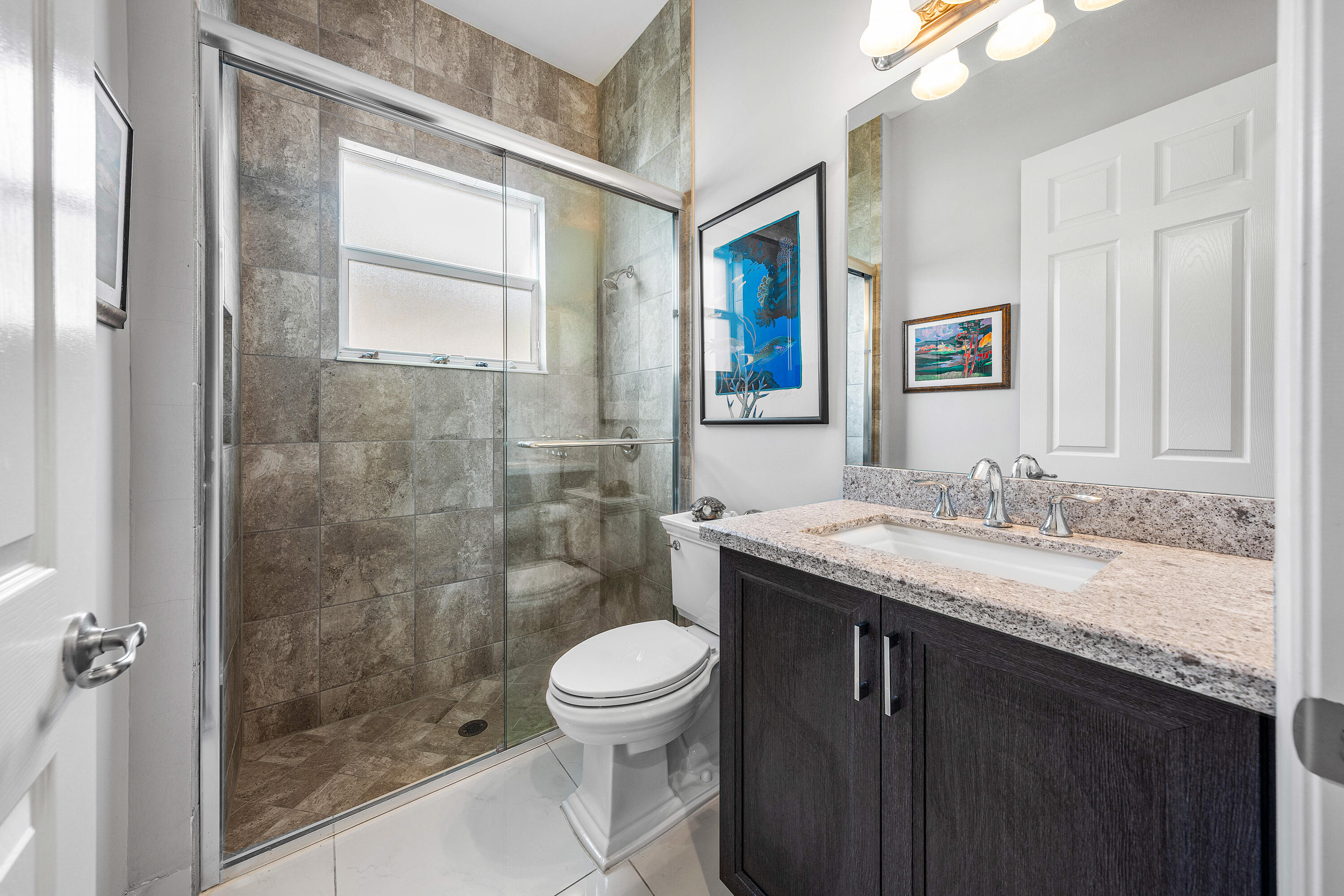 11639 Dawson Range Road Boynton Beach, FL 33473 - Photo 25 of 75 a bathroom with a granite countertop sink toilet and shower