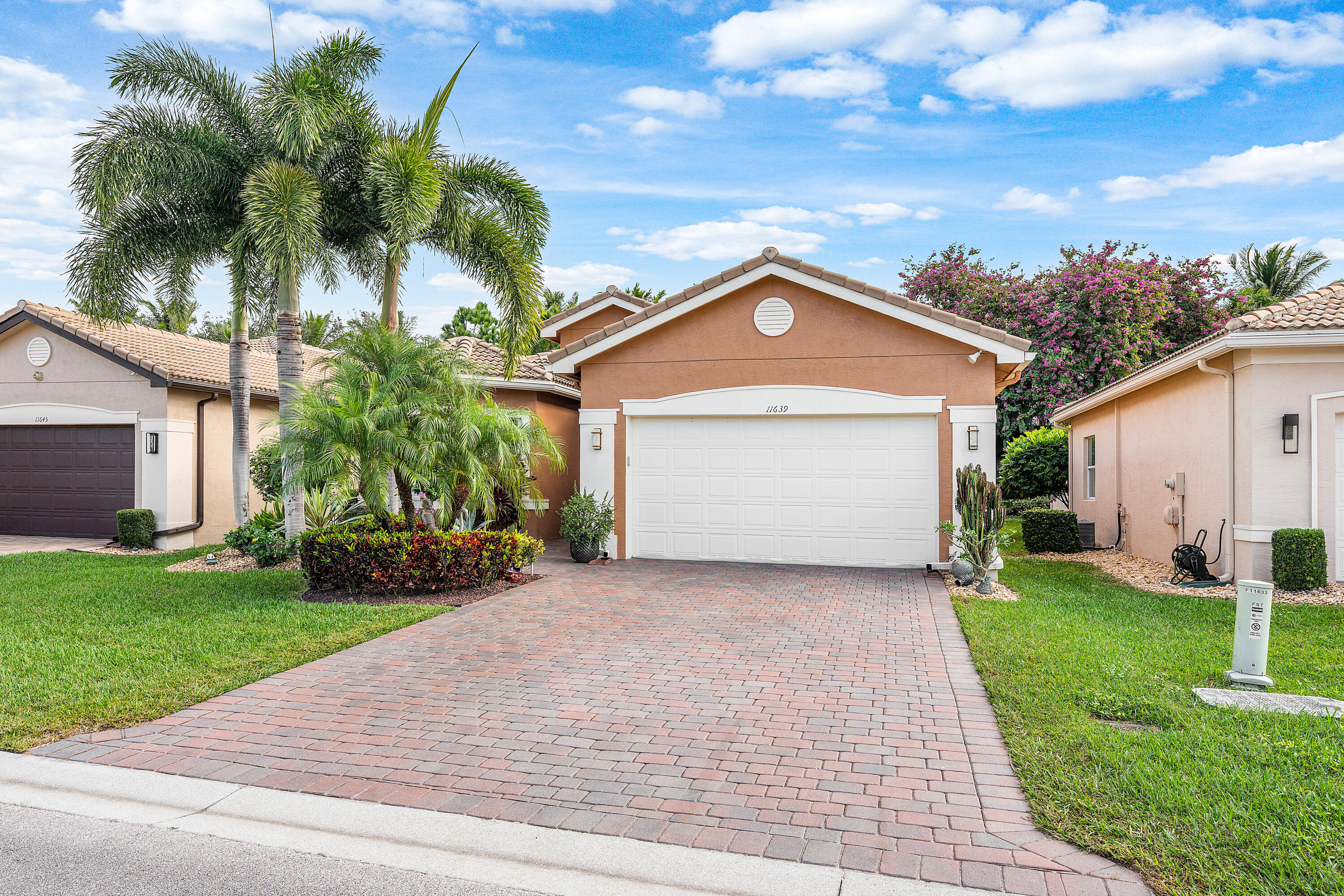 11639 Dawson Range Road Boynton Beach, FL 33473 - Photo 3 of 75 a front view of a house with a yard and garage