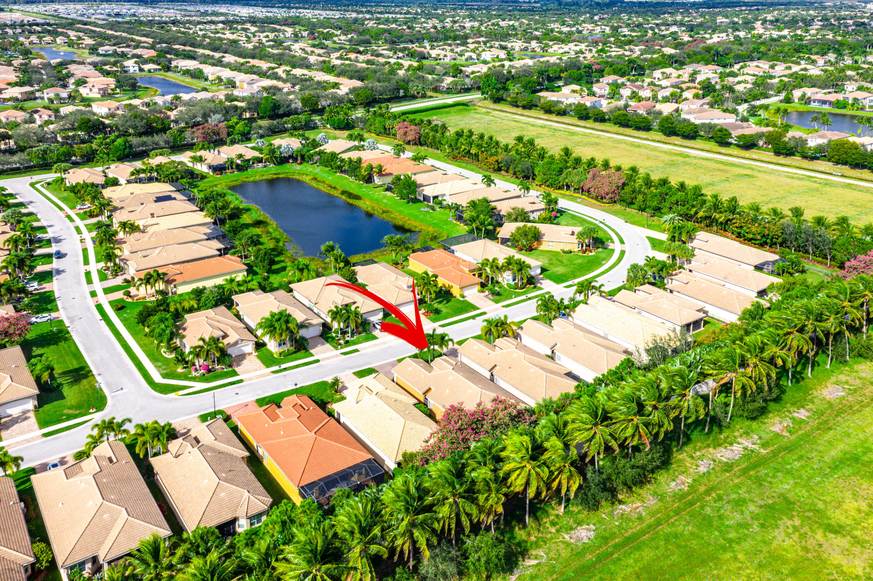 11639 Dawson Range Road Boynton Beach, FL 33473 - Photo 42 of 75 an aerial view of residential houses with outdoor space and river