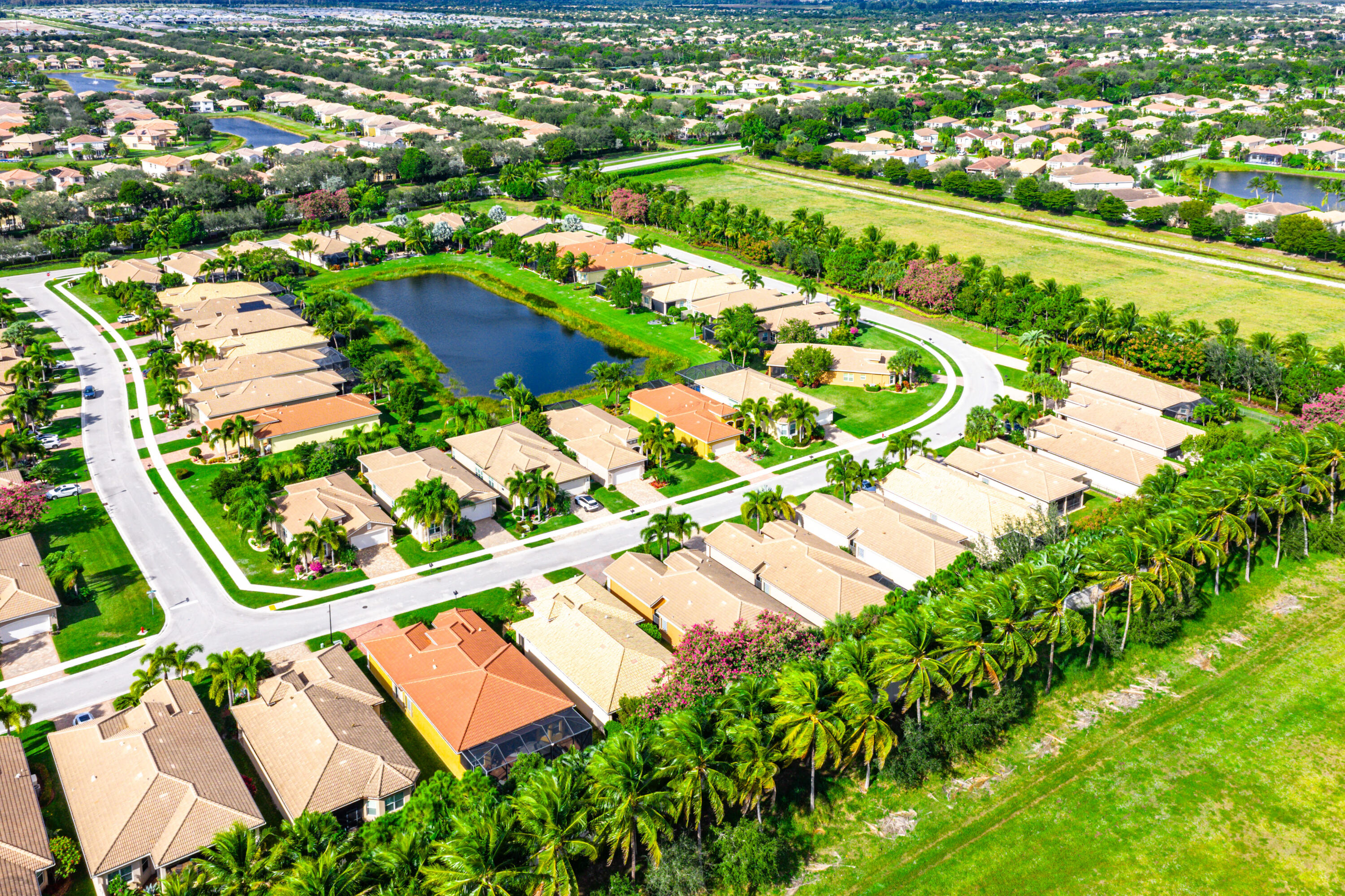 11639 Dawson Range Road Boynton Beach, FL 33473 - Photo 43 of 75 an aerial view of residential houses with outdoor space and river