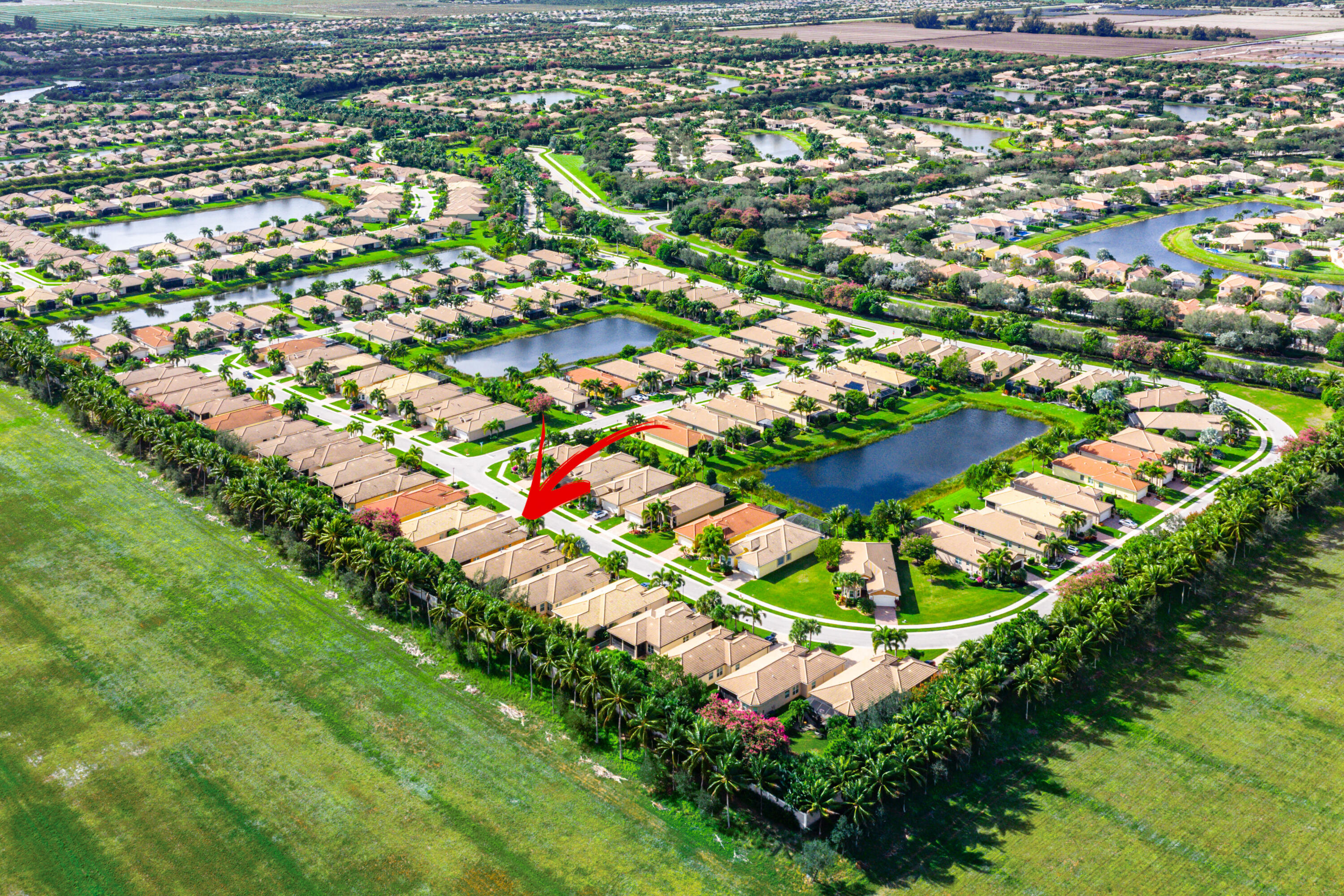 11639 Dawson Range Road Boynton Beach, FL 33473 - Photo 46 of 75 an aerial view of residential houses with outdoor space and trees