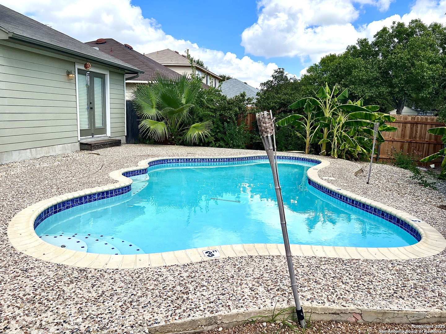 8218 Coppergate Converse, TX 78109 - Photo 15 of 15 a view of a swimming pool with a patio