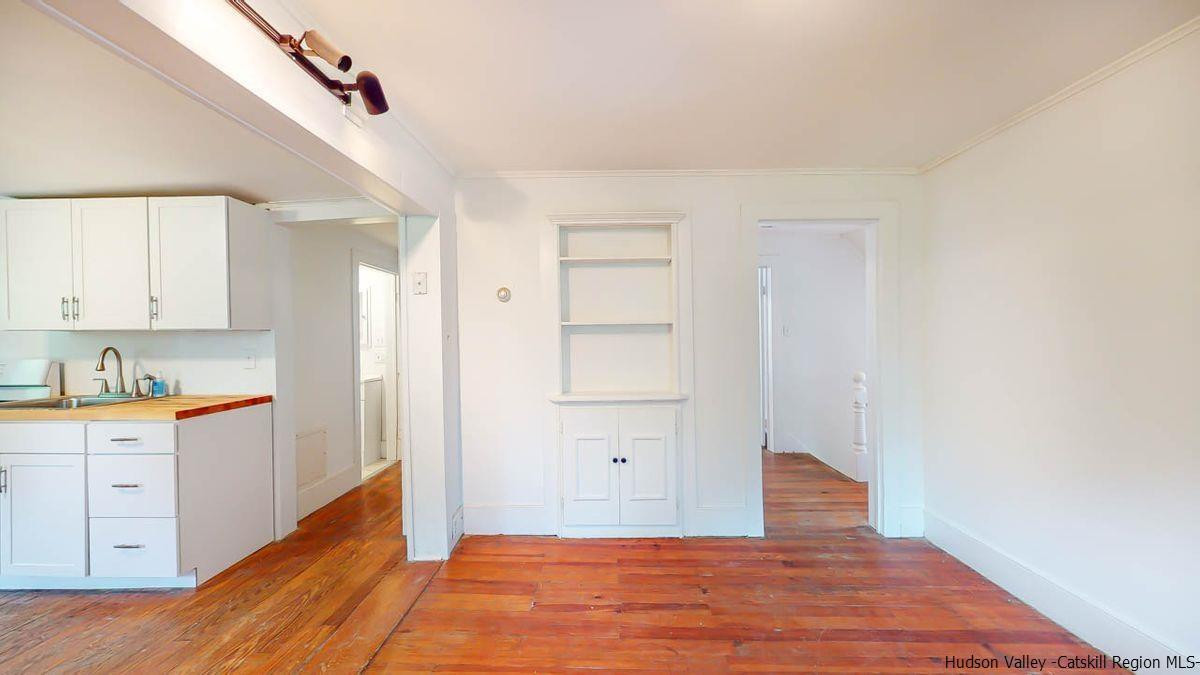 3418 Cooper Street Stone Ridge, NY 12484 - Photo 15 of 34 a view of a kitchen with wooden floor and cabinets