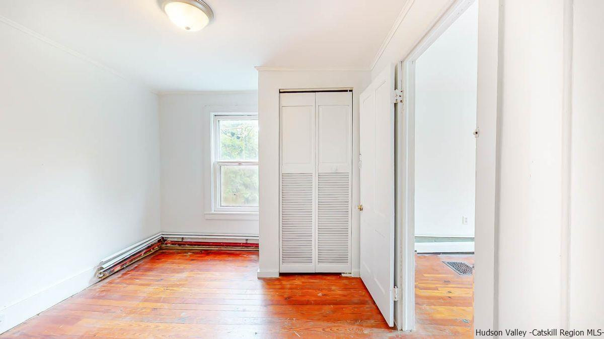 3418 Cooper Street Stone Ridge, NY 12484 - Photo 21 of 34 a view of room with window and hardwood floor