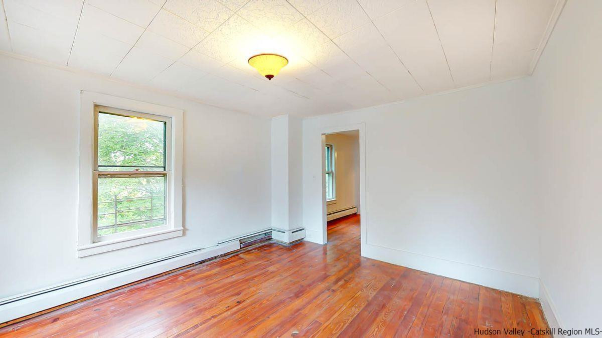 3418 Cooper Street Stone Ridge, NY 12484 - Photo 26 of 34 an empty room with window