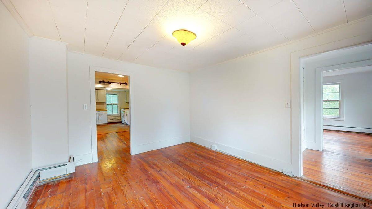 3418 Cooper Street Stone Ridge, NY 12484 - Photo 27 of 34 wooden floor in an empty room with a window