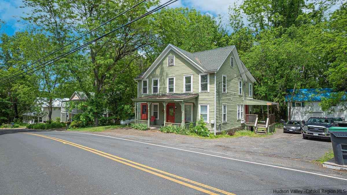 3418 Cooper Street Stone Ridge, NY 12484 - Photo 28 of 34 a front view of a house with a garden