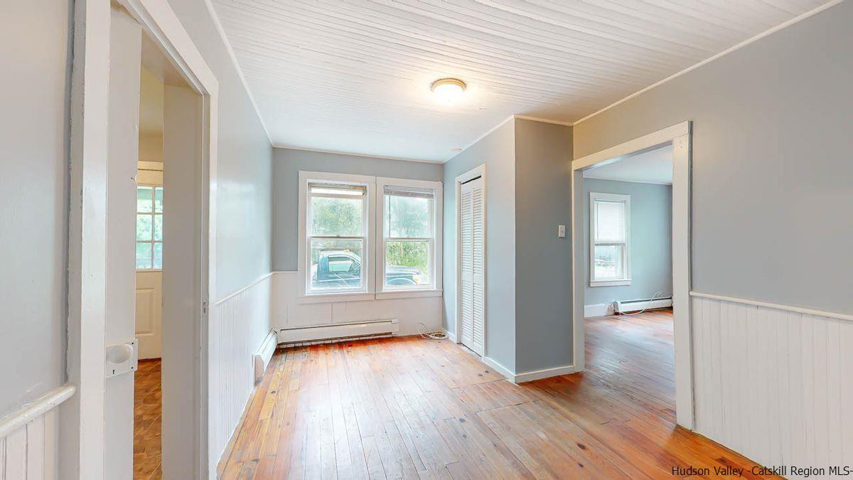 3418 Cooper Street Stone Ridge, NY 12484 - Photo 7 of 34 wooden floor in an empty room with a window