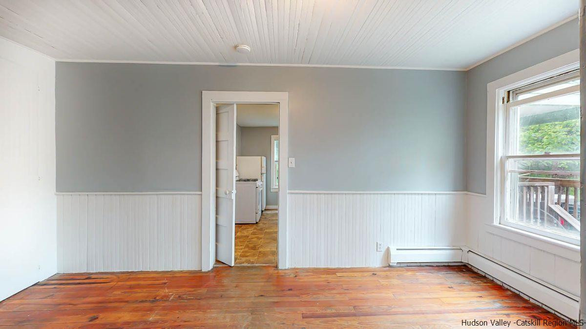 3418 Cooper Street Stone Ridge, NY 12484 - Photo 8 of 34 a view of empty room with wooden floor and fan