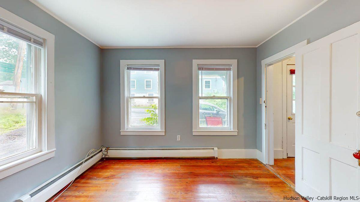 3418 Cooper Street Stone Ridge, NY 12484 - Photo 10 of 34 a view of an empty room with wooden floor and a window