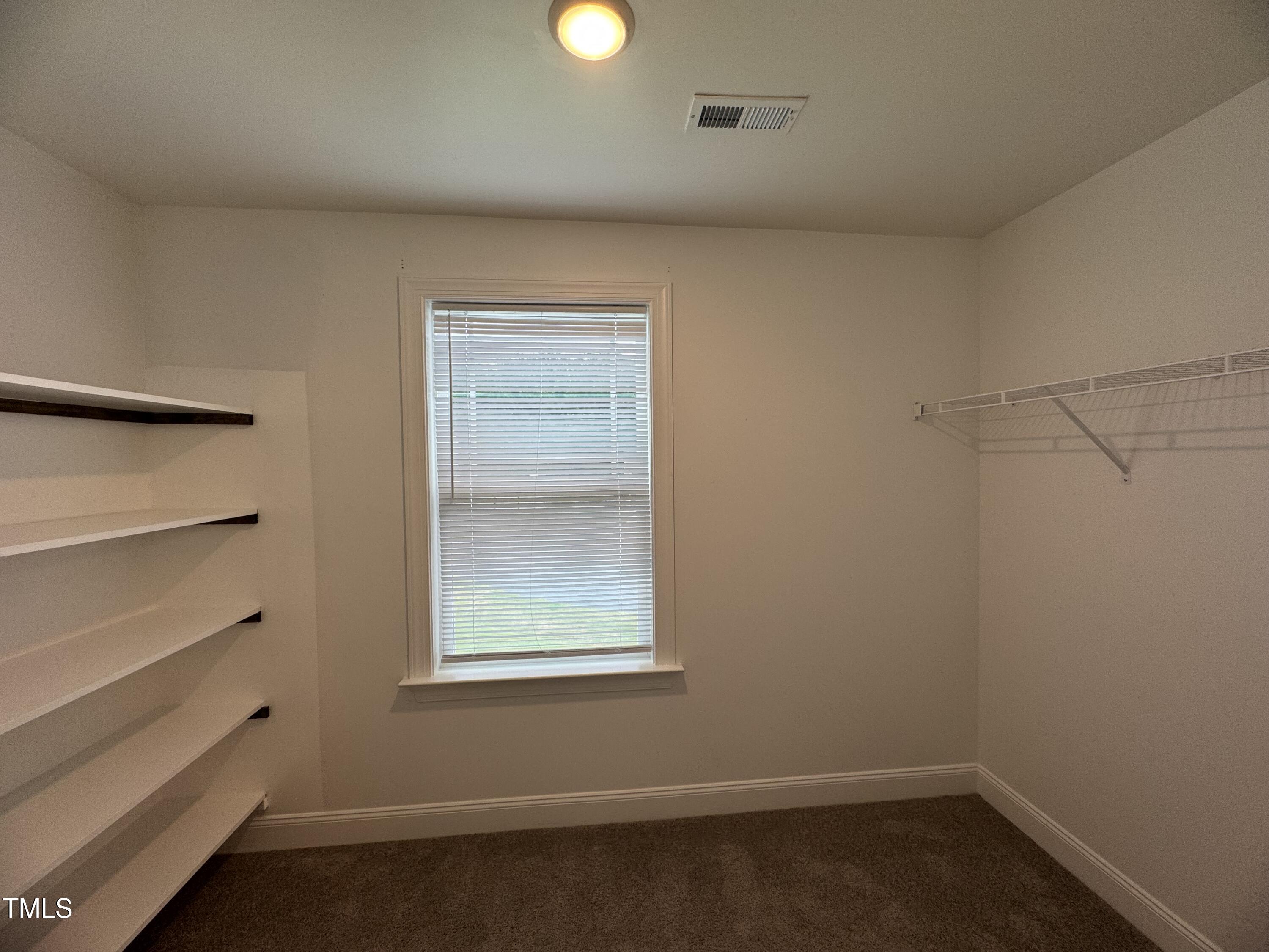 52 Shining Pearl Court Smithfield, NC 27577 - Photo 15 of 23 an empty room with a window