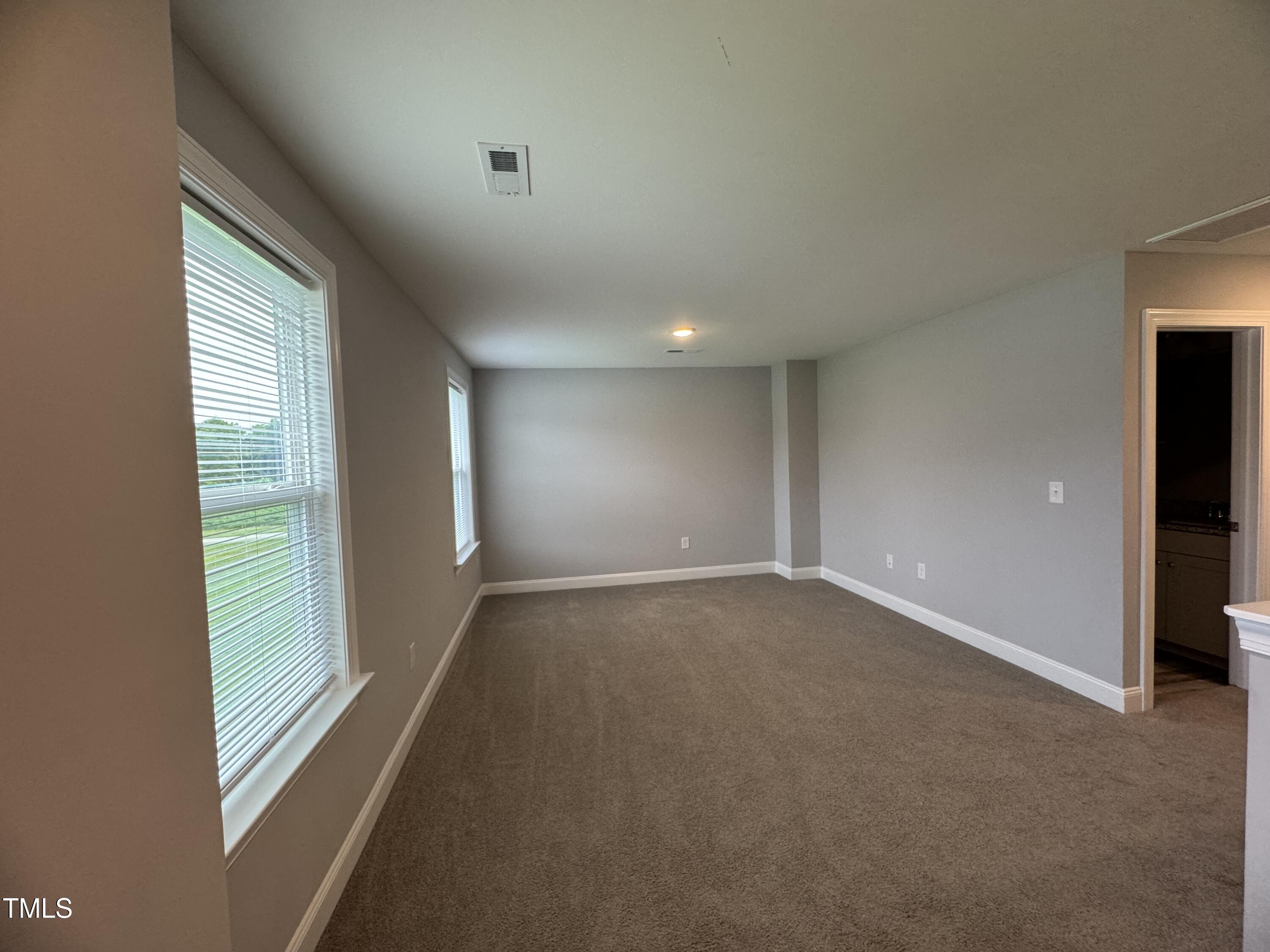 52 Shining Pearl Court Smithfield, NC 27577 - Photo 18 of 23 a view of an empty room with a window