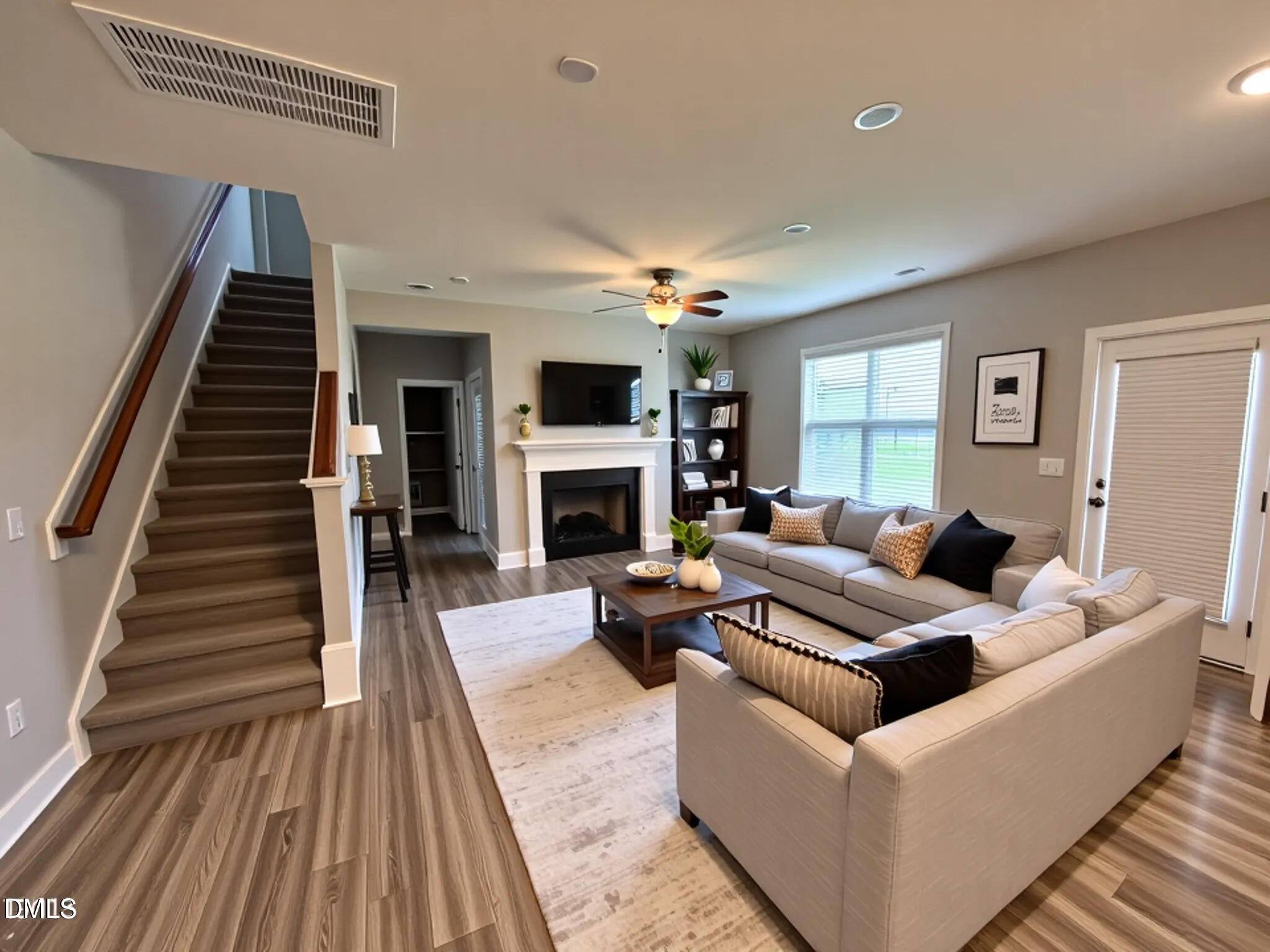 52 Shining Pearl Court Smithfield, NC 27577 - Photo 2 of 23 a living room with furniture and a fireplace
