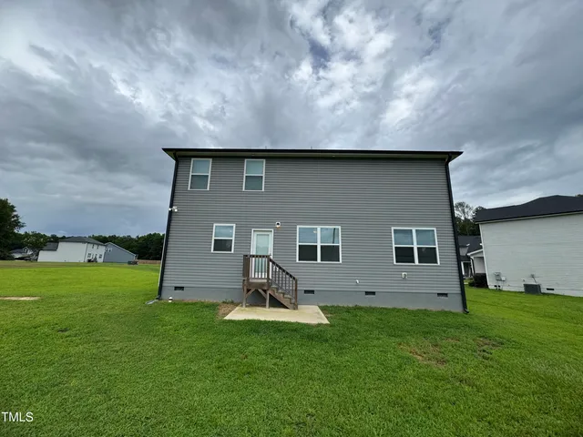 a house view with a garden space