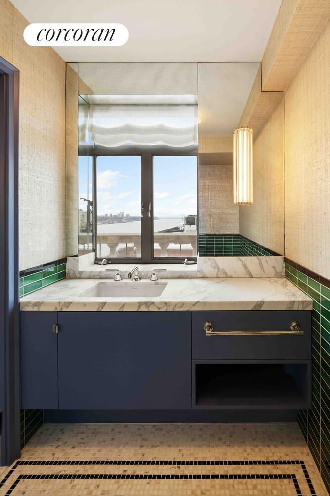 140 Riverside Drive, Unit 19HO Manhattan, NY 10024 - Photo 21 of 35 a bathroom with a sink and a mirror