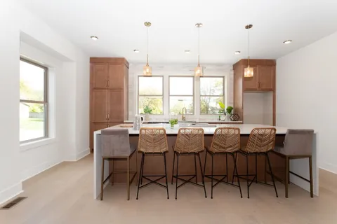 a view of a dining room with furniture and window