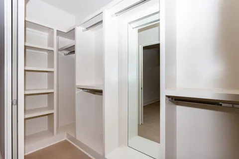 a bathroom with a double vanity sink mirror and shower