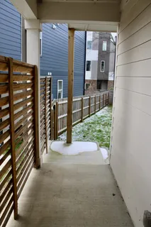 a view of a back yard from a balcony