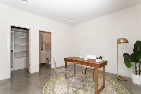 a workspace with furniture and window